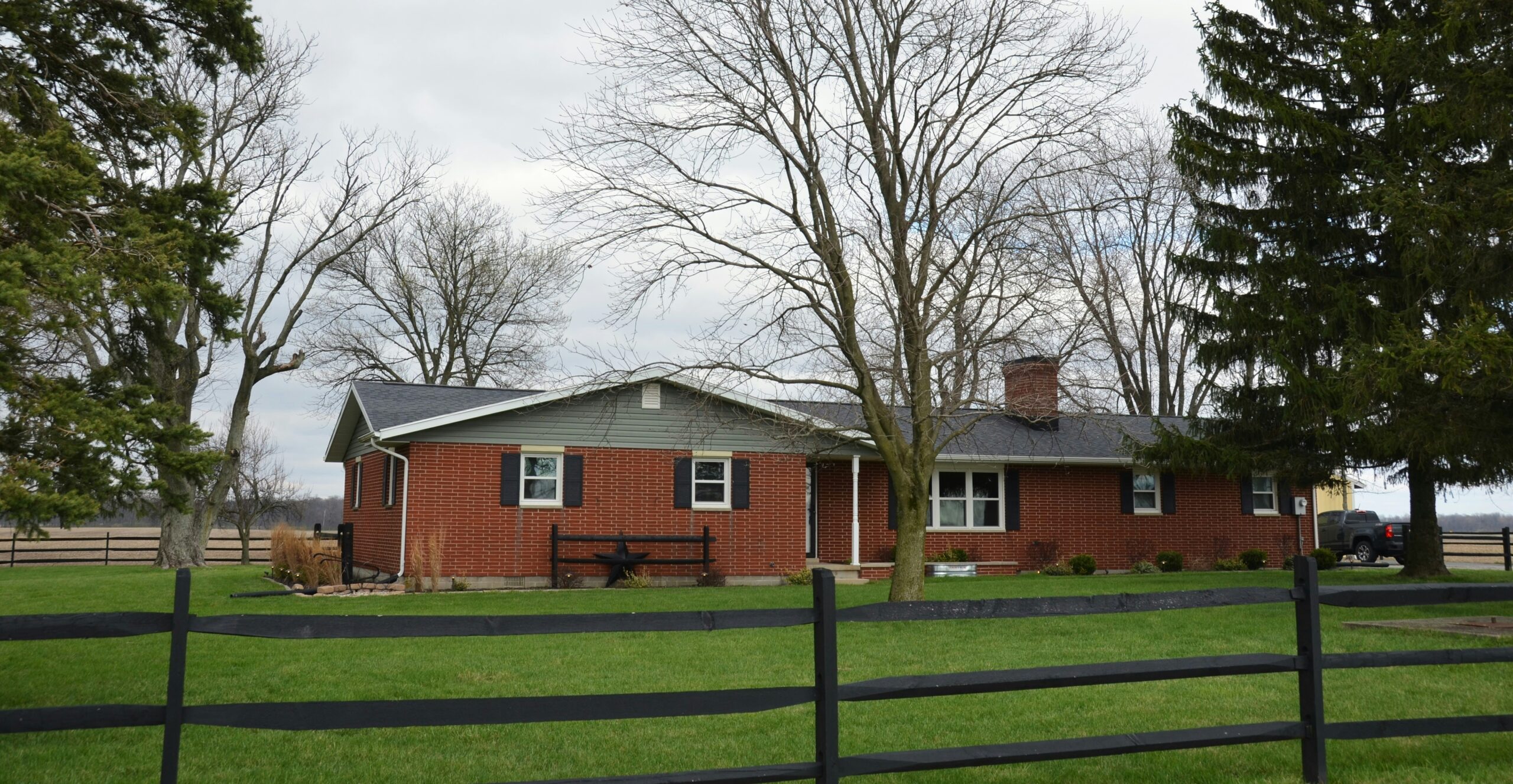 Ranch-style home exterior in Leo-Cedarville, IN with a well-maintained roof.